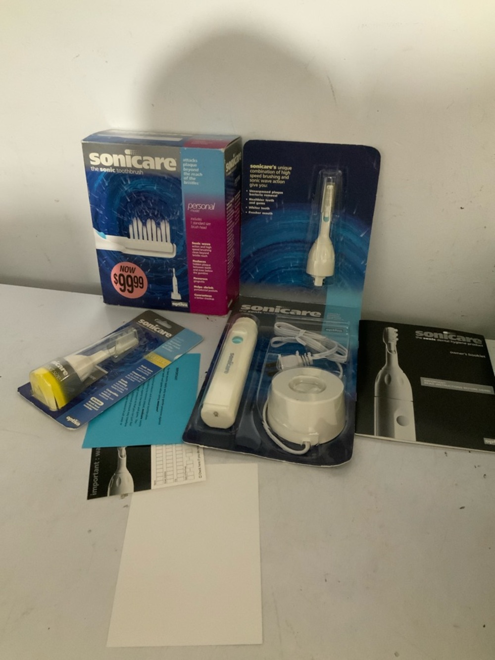 New Optiva Sonicare Plus Model Electric Toothbrush, W/Brush Heads. Open box.